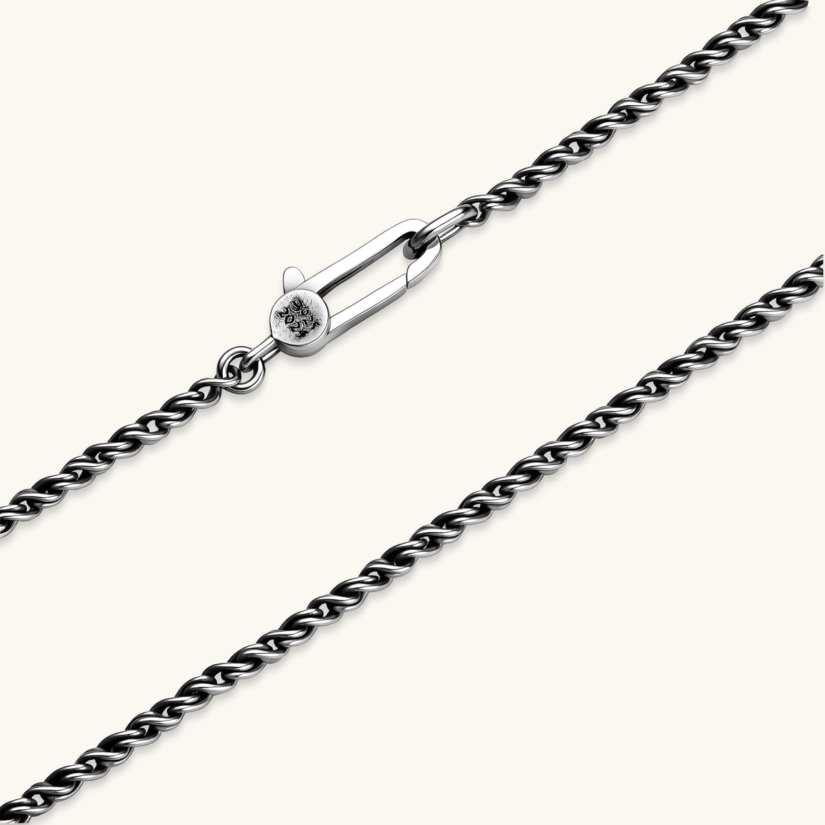 Oxidized 925 sterling silver rope chain necklace, 2.1mm width, carabiner clasp with brand stamp, on cream background.