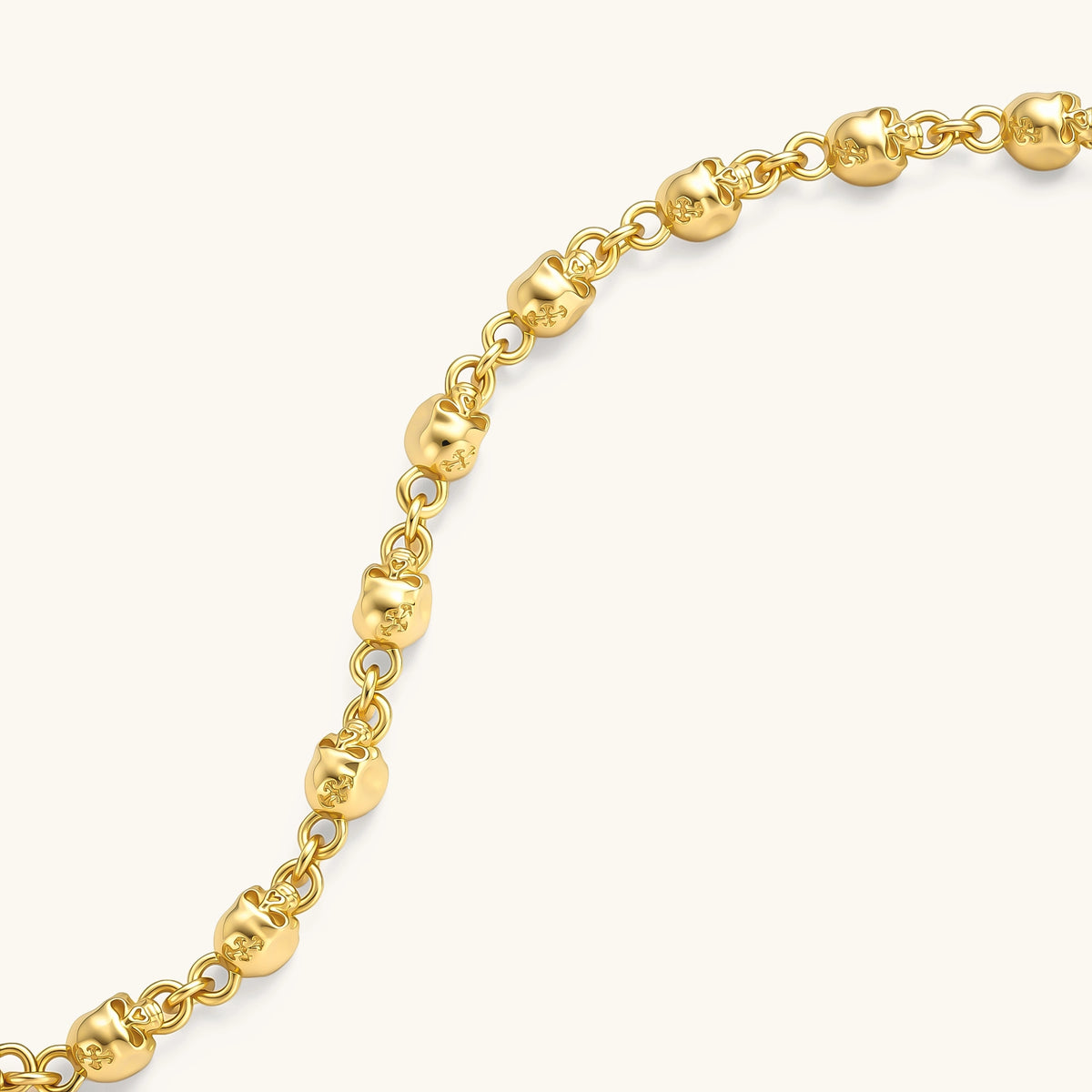 24K gold plated sterling silver bracelet with polished skull beads on a rolo chain link, hook-and-eye clasp, 200mm length.