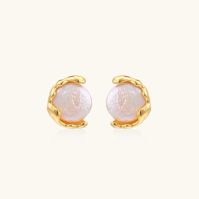 Gold-plated sterling silver stud earrings with organic claw settings cradling lustrous freshwater pearls on white background.