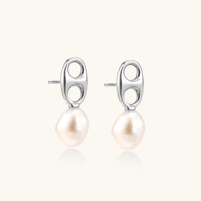 Sterling silver oval stud earrings with dual circular cutouts and suspended freshwater pearls on white background.
