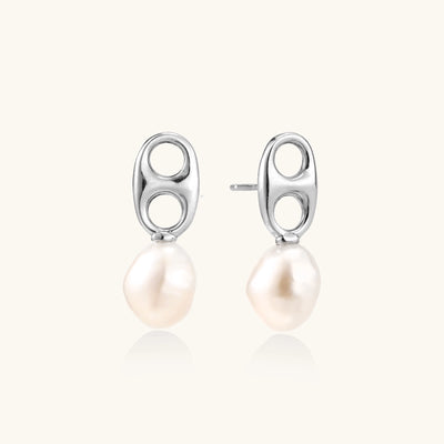 Sterling silver oval stud earrings with dual circular cutouts and suspended freshwater pearls on white background.