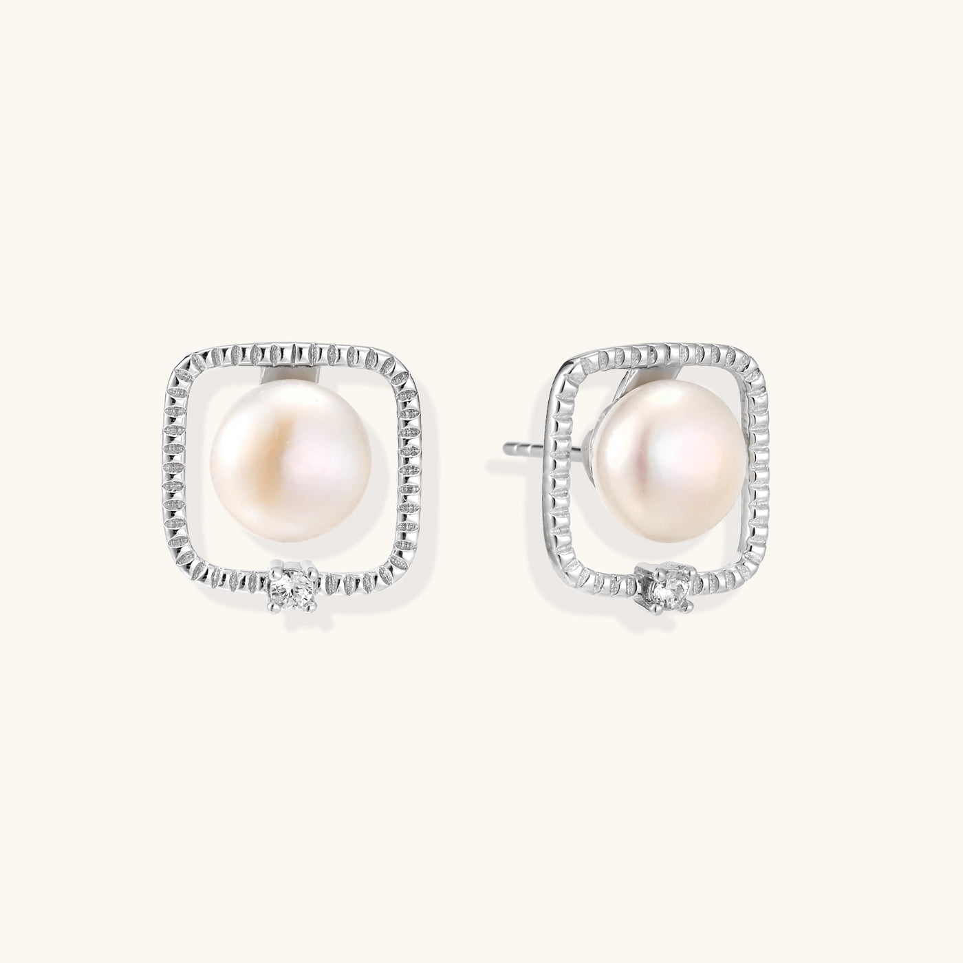 Square sterling silver stud earrings with freshwater pearls and crystal accents on white background.