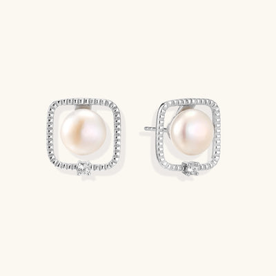 Square sterling silver stud earrings with freshwater pearls and crystal accents on white background.