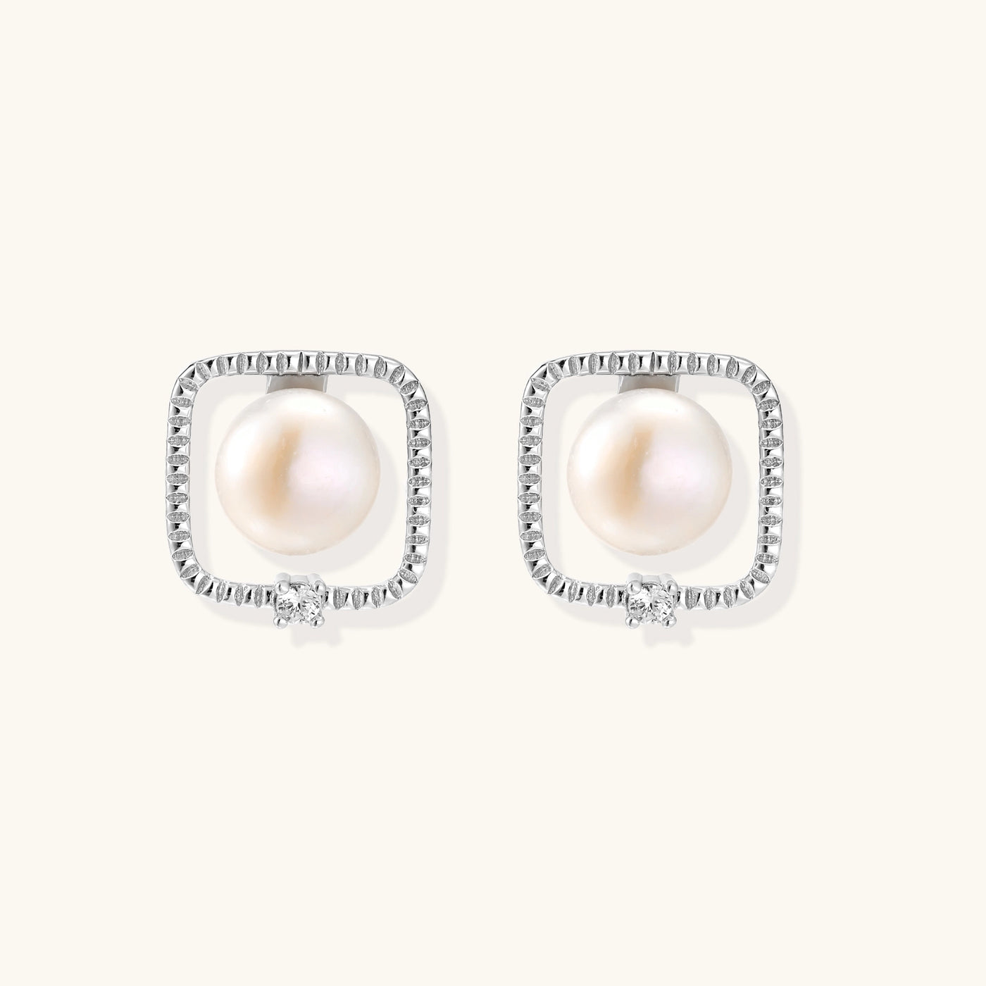 Square sterling silver stud earrings with freshwater pearls and crystal accents on white background.