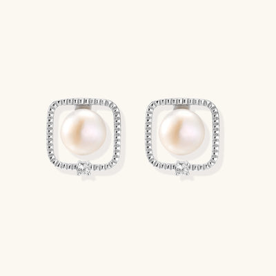 Square sterling silver stud earrings with freshwater pearls and crystal accents on white background.