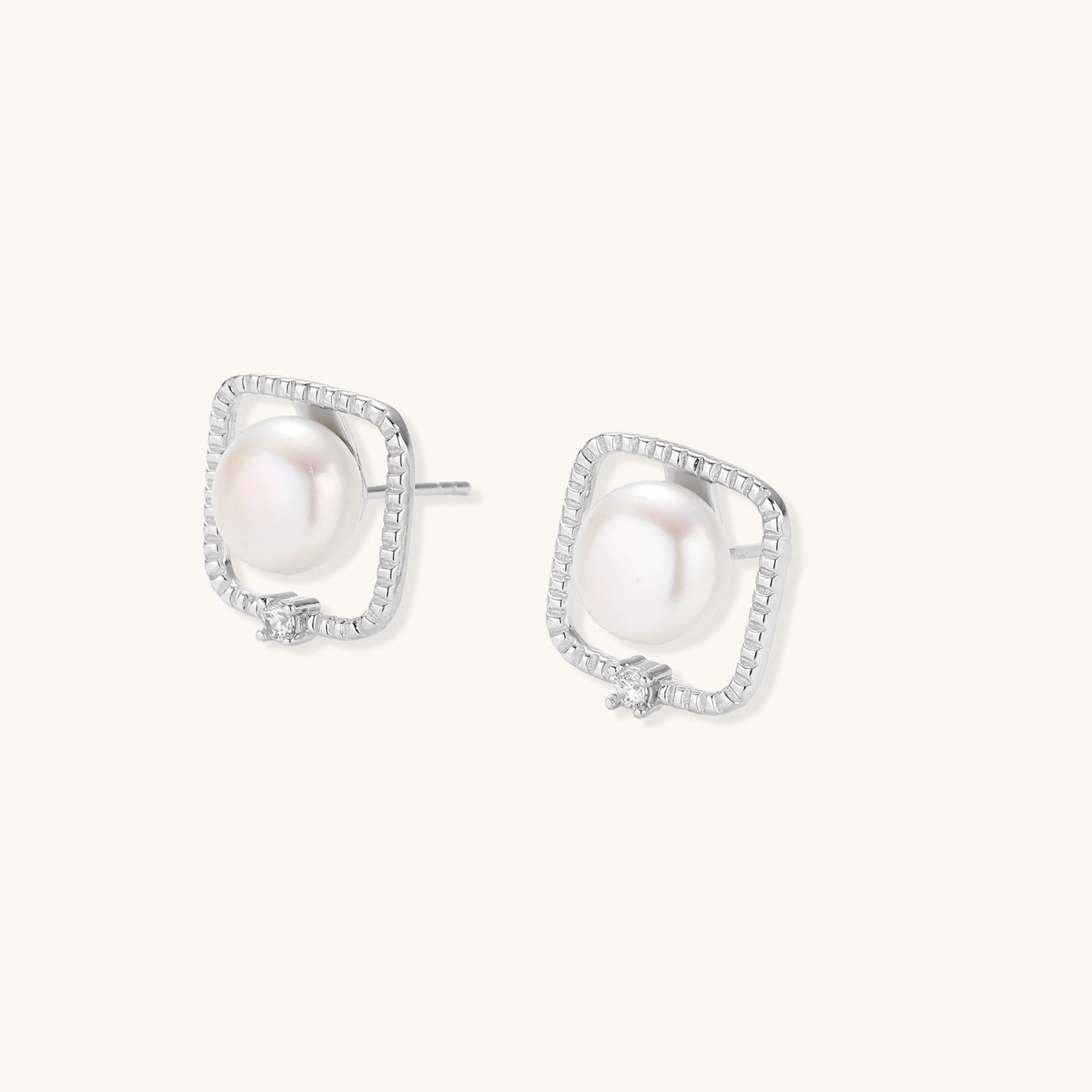 Square sterling silver stud earrings with freshwater pearls and crystal accents on white background.