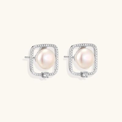 Square sterling silver stud earrings with freshwater pearls and crystal accents on white background.