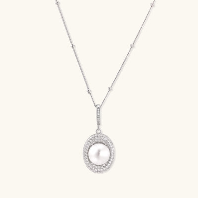 Sterling silver necklace with freshwater pearl in sparkling crystal halo pendant on delicate beaded chain