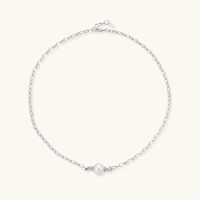 Sterling silver chain necklace with single white freshwater pearl centerpiece on neutral background, 445mm length.