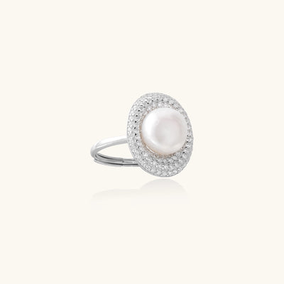 Sterling silver ring with 9mm freshwater pearl center surrounded by double halo of sparkling crystals