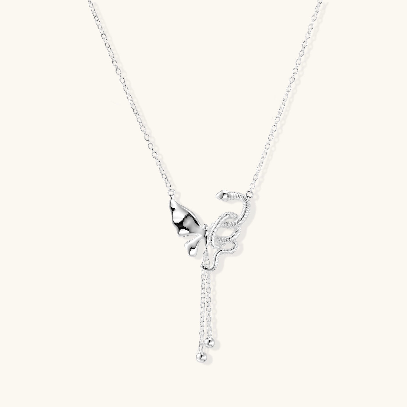 Delicate sterling silver butterfly pendant necklace with textured wing details and adjustable chain on white background