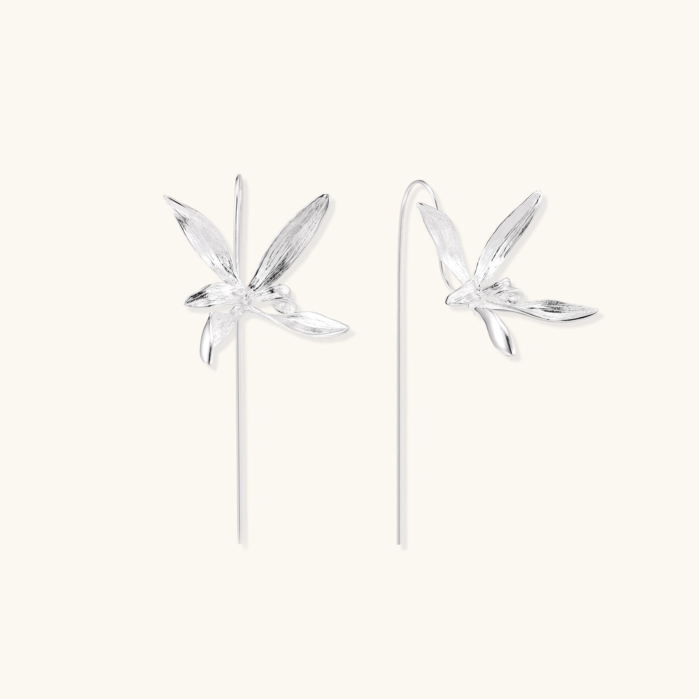 Delicate sterling silver flower earrings with long threader posts and five-petal design on white background.