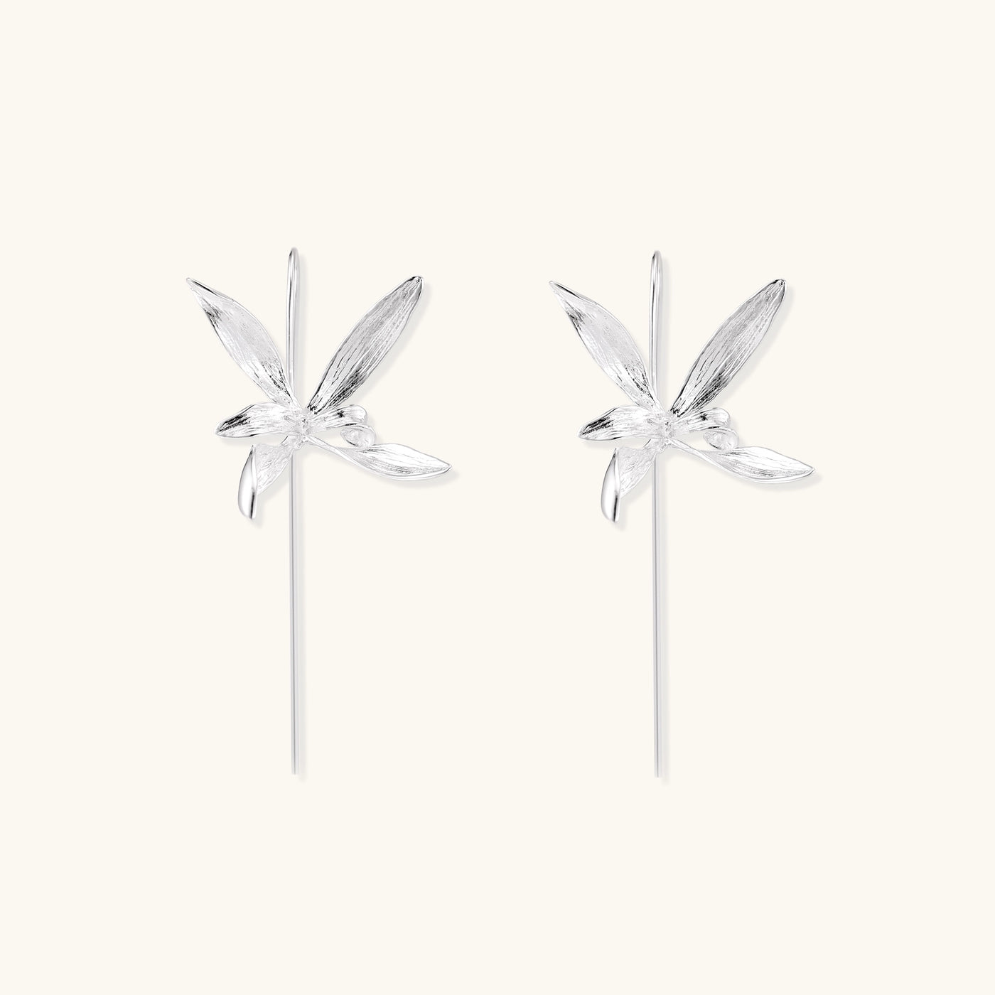 Delicate sterling silver flower earrings with long threader posts and five-petal design on white background.