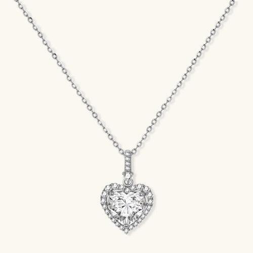Complete jewelry set with heart-shaped sterling silver pieces featuring brilliant moissanite stones on white background.