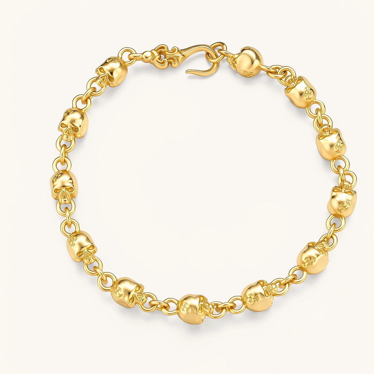 24K gold plated sterling silver bracelet with polished skull beads on a rolo chain link, hook-and-eye clasp, 200mm length.