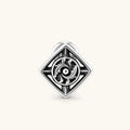 925 sterling silver square stud earring with oxidized black finish, swirling eye motif, and compass spike corners. 9.1mm.