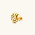 Side view of a round gold stud earring with raised baroque scroll engraving, domed border, and butterfly push-back closure.