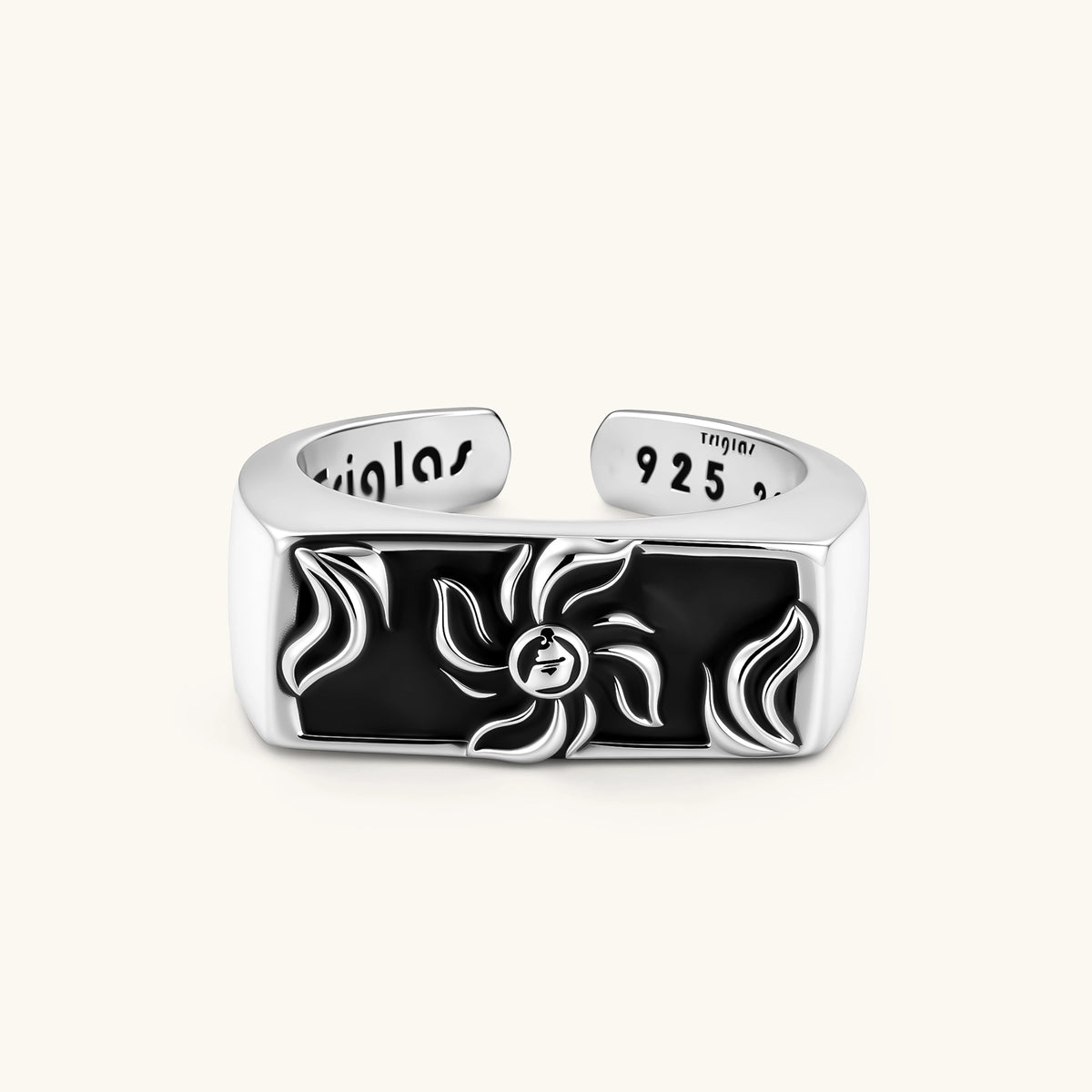 925 sterling silver open signet ring with rectangular black enamel face and raised silver sun-spider motif, adjustable band.