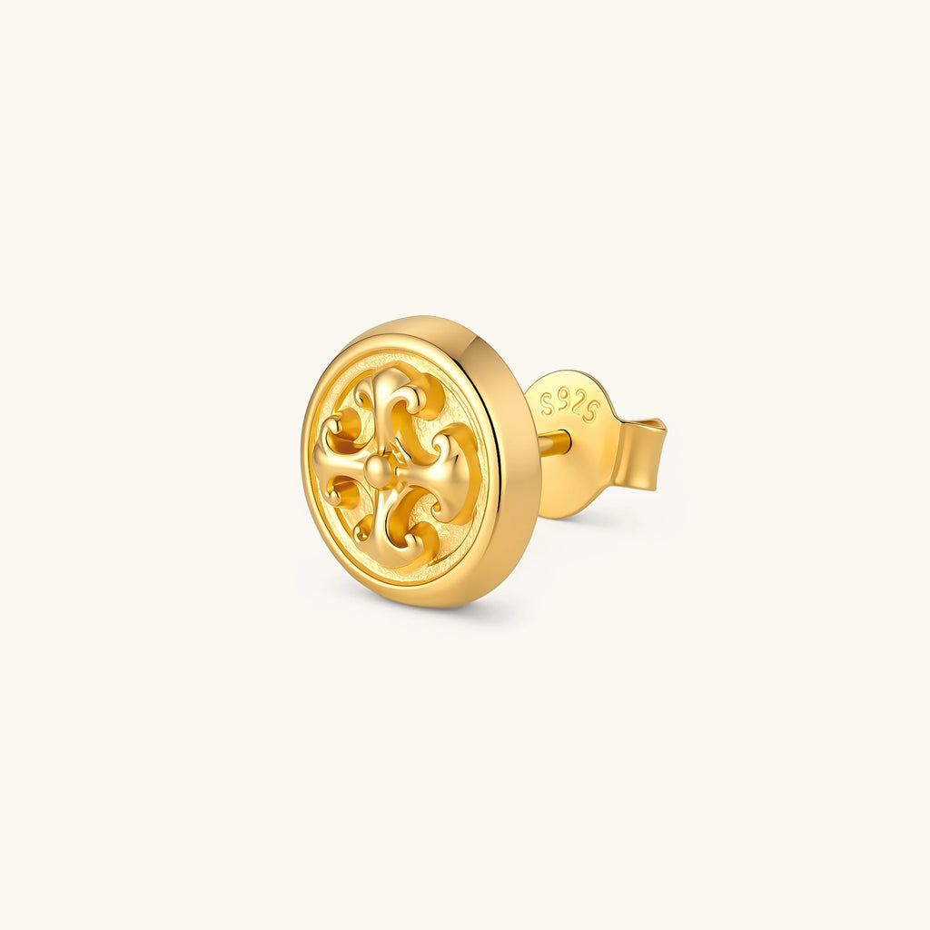 Gold circular stud earring with raised baroque scroll motif, polished bezel edge, and butterfly push-back closure. S925 stamped.